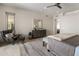 A main bedroom has a decorative dresser and mirror, as well as a chair with ottoman at 5533 E Stella Ln, Paradise Valley, AZ 85253