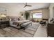 Spacious bedroom with large windows, plush carpet, and access to a private balcony at 5533 E Stella Ln, Paradise Valley, AZ 85253