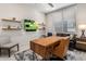 A modern home office has floating shelves and a desk with a leather rolling chair at 5533 E Stella Ln, Paradise Valley, AZ 85253