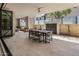 Spacious covered patio with a dining table, water feature, and privacy screen at 5533 E Stella Ln, Paradise Valley, AZ 85253