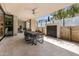 Covered patio with dining table, water feature, and seamless indoor-outdoor living at 5533 E Stella Ln, Paradise Valley, AZ 85253