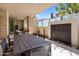 Relaxing covered patio with dining table, water feature, and desert landscaping at 5533 E Stella Ln, Paradise Valley, AZ 85253