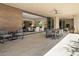 Expansive covered patio with outdoor dining, seating, and seamless indoor-outdoor flow at 5533 E Stella Ln, Paradise Valley, AZ 85253