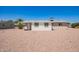 Wide backyard with gravel providing lots of space and low upkeep, ideal for outdoor activities at 6043 E Des Moines St, Mesa, AZ 85205