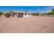 Extensive gravel backyard provides ample space with low maintenance; perfect for customization at 6043 E Des Moines St, Mesa, AZ 85205