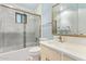 Well-lit bathroom featuring a shower-tub combination and a vanity with a mirror at 6043 E Des Moines St, Mesa, AZ 85205