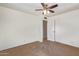 Bedroom featuring neutral carpet, a ceiling fan, and closet for storage at 6043 E Des Moines St, Mesa, AZ 85205
