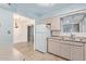 The kitchen features a refrigerator, and a view into the adjacent dining area at 6043 E Des Moines St, Mesa, AZ 85205