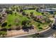 This aerial view showcases a community park with lush green spaces, walking paths, and recreational facilities in a vibrant neighborhood at 6126 E Paradise Ln, Scottsdale, AZ 85254