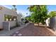 Enclosed backyard featuring desert landscaping, a patio and a view of palm trees at 6126 E Paradise Ln, Scottsdale, AZ 85254