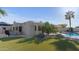 Spacious backyard with a covered patio and pool area surrounded by lush landscaping at 6126 E Paradise Ln, Scottsdale, AZ 85254