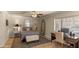 Comfortable bedroom with a ceiling fan, a dark accent rug and a work space by the window at 6126 E Paradise Ln, Scottsdale, AZ 85254