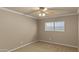 Neutral bedroom with a ceiling fan, carpeted floor, window and empty space ready for furnishings at 6126 E Paradise Ln, Scottsdale, AZ 85254