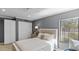 Bright bedroom featuring a full bed, a window, carpeted floor, and a closet at 6126 E Paradise Ln, Scottsdale, AZ 85254