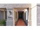 Close-up view of the home's entryway, featuring a tiled walkway and a dark-colored double front door at 6126 E Paradise Ln, Scottsdale, AZ 85254