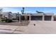 Charming home showcasing desert landscaping, a paved driveway, and a spacious two-car garage at 6126 E Paradise Ln, Scottsdale, AZ 85254