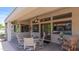 Covered patio with a dining set, providing an ideal space for outdoor meals and gatherings at 6126 E Paradise Ln, Scottsdale, AZ 85254
