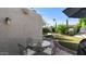Outdoor patio featuring a stone tile floor, seating and a view of the backyard at 6126 E Paradise Ln, Scottsdale, AZ 85254