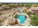 Aerial view of a home with a backyard pool, playground, and desert landscaping at 6713 E Riverdale St, Mesa, AZ 85215