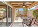 This covered back patio has space for dining or a conversation set for entertaining guests at 6713 E Riverdale St, Mesa, AZ 85215