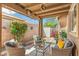 A covered patio provides a comfortable outdoor retreat for enjoying meals and entertaining guests at 6713 E Riverdale St, Mesa, AZ 85215