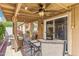 The covered patio has a ceiling fan and lights, perfect for enjoying warm summer evenings at 6713 E Riverdale St, Mesa, AZ 85215