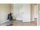 Exercise area with tile floors and large closet for storage and organization at 6713 E Riverdale St, Mesa, AZ 85215