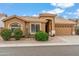 Inviting single-story home with a tile roof, well-maintained desert landscaping, and attached two-car garage at 6713 E Riverdale St, Mesa, AZ 85215