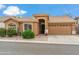 Charming single-story home featuring desert landscaping, a tile roof, and an attached two-car garage at 6713 E Riverdale St, Mesa, AZ 85215
