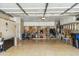 Spacious garage with epoxy floors, storage cabinets, and plenty of room for parking and projects at 6713 E Riverdale St, Mesa, AZ 85215