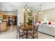 Open concept living space features kitchen, dining area, and living room at 6713 E Riverdale St, Mesa, AZ 85215