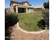 Expansive backyard with a covered patio and lush green grass, perfect for outdoor entertaining and relaxation at 6967 W Potter Dr, Glendale, AZ 85308