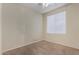 Neutral bedroom with beige walls, ceiling fan, and ample natural light at 6967 W Potter Dr, Glendale, AZ 85308