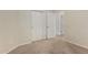 Bedroom with tan carpet, white walls and a closet with sliding doors at 6967 W Potter Dr, Glendale, AZ 85308