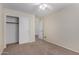 A secondary bedroom has closet space, carpet, and ceiling fan at 6967 W Potter Dr, Glendale, AZ 85308