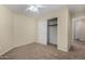 Neutral bedroom with closet, carpeted floors and white trim for a serene atmosphere at 6967 W Potter Dr, Glendale, AZ 85308
