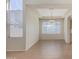 Bright dining room with large windows, neutral walls, and tile floors at 6967 W Potter Dr, Glendale, AZ 85308
