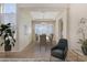 Elegant dining room with a modern chandelier, neutral walls, and stylish furnishings at 6967 W Potter Dr, Glendale, AZ 85308