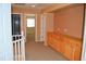 Second-floor hallway with built-in cabinets, carpeted floors, and natural light at 6967 W Potter Dr, Glendale, AZ 85308