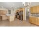 Spacious kitchen featuring stainless steel appliances, an island, and wooden cabinetry at 6967 W Potter Dr, Glendale, AZ 85308