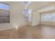 Open living room with tall ceilings, neutral walls, and lots of natural light at 6967 W Potter Dr, Glendale, AZ 85308
