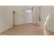 Large living room featuring tile floors, high ceilings, neutral walls, and abundant natural light at 6967 W Potter Dr, Glendale, AZ 85308