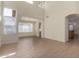 Bright living room featuring tile floors, high ceilings, neutral walls, and large windows at 6967 W Potter Dr, Glendale, AZ 85308