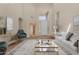 Virtually staged living room showcasing stylish decor, high ceilings, and natural light at 6967 W Potter Dr, Glendale, AZ 85308