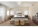 The main bedroom features natural light, carpet floors, ceiling fan, and neutral color palette at 6967 W Potter Dr, Glendale, AZ 85308
