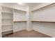 A walk-in closet provides ample storage space with shelving and wooden hanging rails at 6967 W Potter Dr, Glendale, AZ 85308