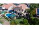 Back view showcasing pool and patio with lush green grass at 7015 W Behrend Dr, Glendale, AZ 85308
