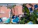Aerial view of homes with tile roofs, pools, and manicured lawns showcasing community design at 7015 W Behrend Dr, Glendale, AZ 85308