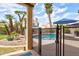 Charming backyard with a refreshing pool, shaded patio, and privacy fencing at 7015 W Behrend Dr, Glendale, AZ 85308