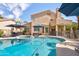 Beautiful pool area with mature trees and manicured landscaping, ideal for outdoor living at 7015 W Behrend Dr, Glendale, AZ 85308